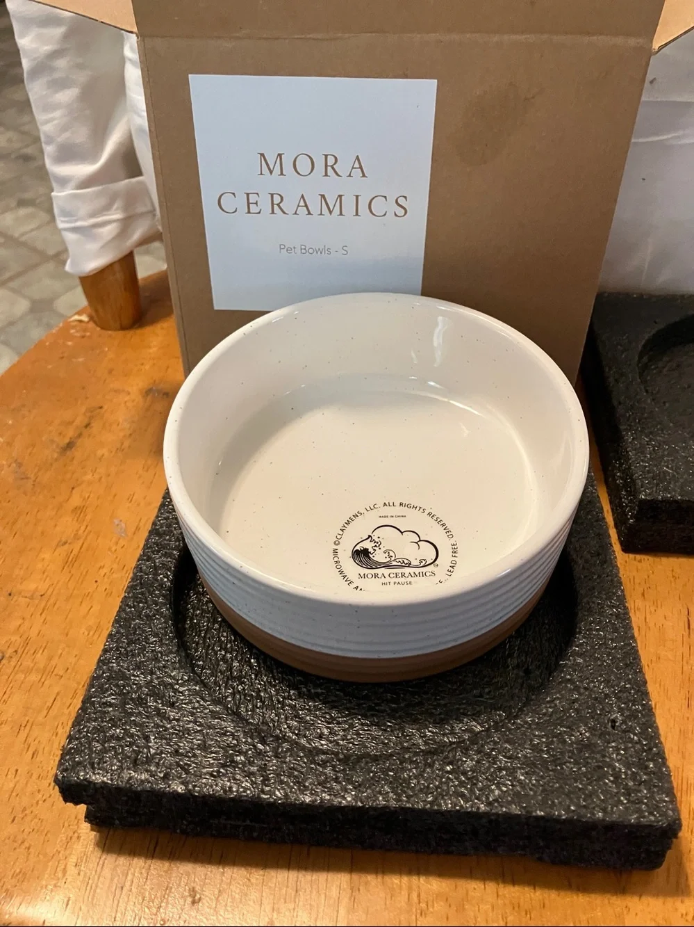 New.  Mora Ceramics tan n white dog bowl in perfect condition